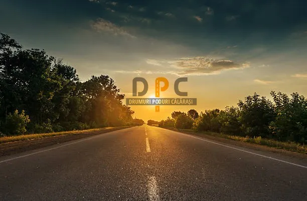 sun in horizon over asphalt road
